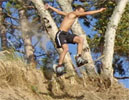 Sam doing a jump on his board.