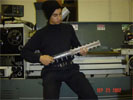 Sam posing in front of a Lathe with the under-construction RailGun.