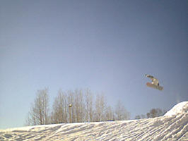 Taking a jump with my snowboard at the Michigan Tech ski&snowboard hill.